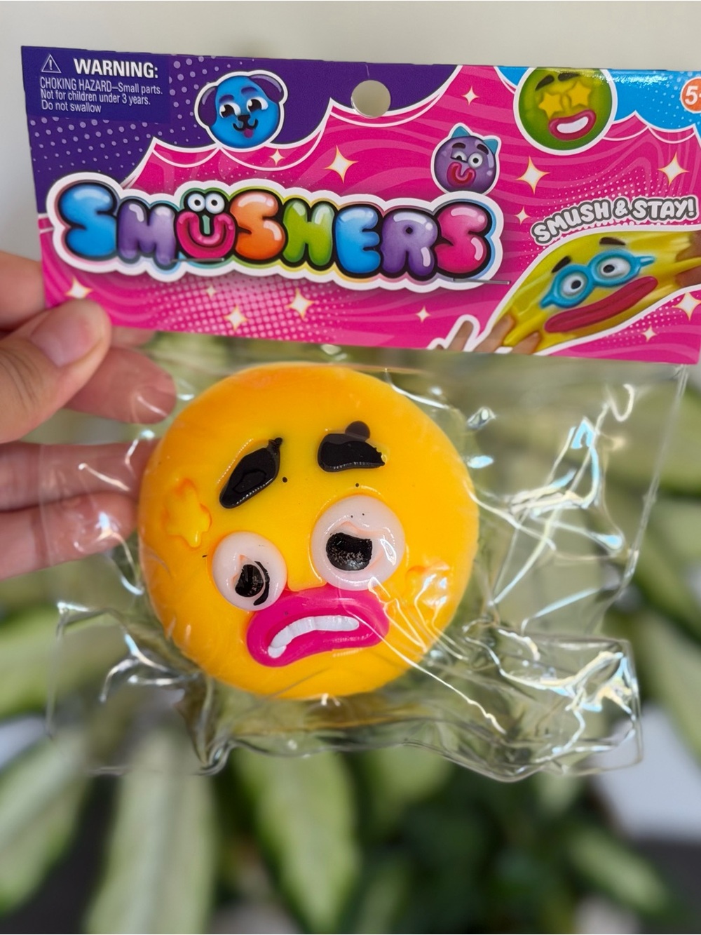 Purple Monster Squishy Toy with Light Blue Horns and Pink Mouth